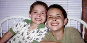 Jona and his brother smiling.