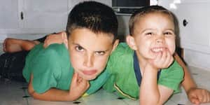 Jona and his brother laying on the kitchen floor.