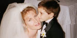 Jona kisses his aunt's cheek at her wedding.