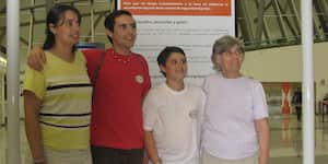 Jona with his brother, aunt, and grandmother in an airport.