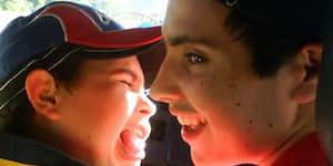 Jona and his brother riding in a car.