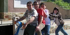 Jona and his brother ride a motorcycle with their friends.