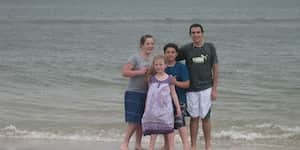 Jona with his brother and cousins at the beach.