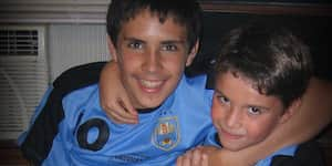 Jona and his brother with a cake.