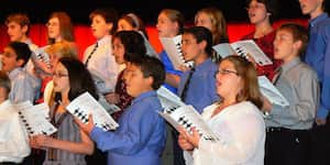 Jona singing during a school program.