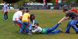 During a capture the flag game at junior high Excursion, Jona is fought over in no-mans' land.