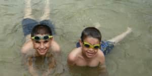 Jona and his brother swimming together.