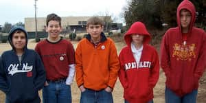 Jona with several of his friends on the recess field at school.